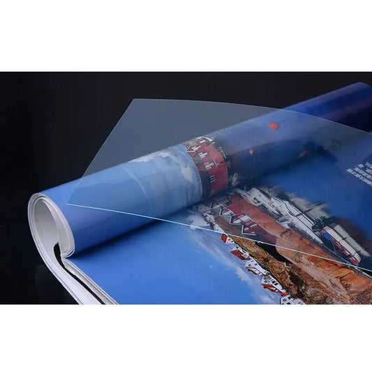 MacBook Pro 16 screen film High-definition screen film placed over a magazine page for protection.