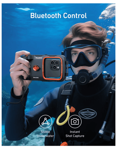 A diver using the TELESIN Underwater Diving Phone Case with Bluetooth control in clear water.