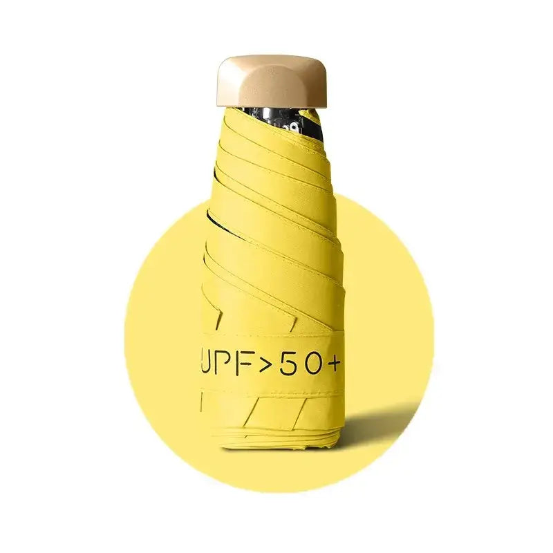 women's UV protection parasol in yellow with UPF 50+ label, designed for sun protection and style.