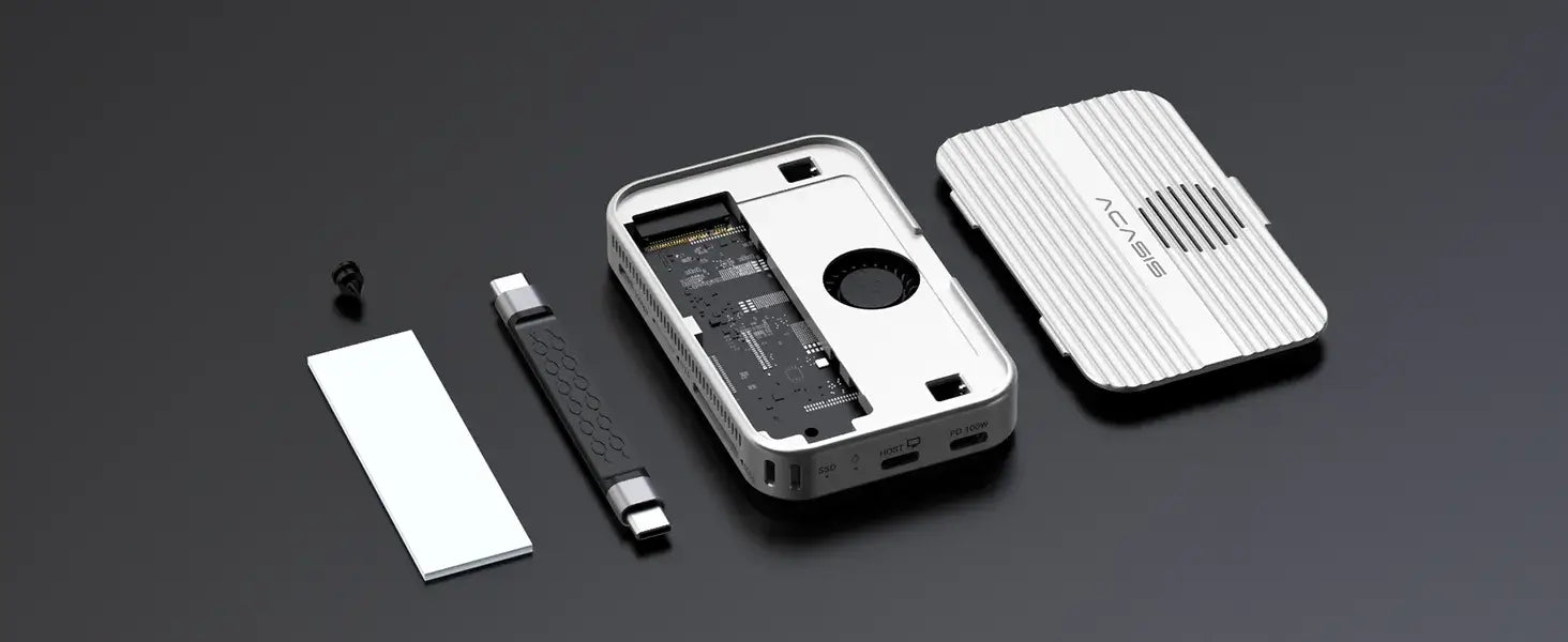 Acasis 10 Gbps Magnetic M.2 NVMe SSD Enclosure – USB-C Dock 4 K Hub components laid out on a black surface.
