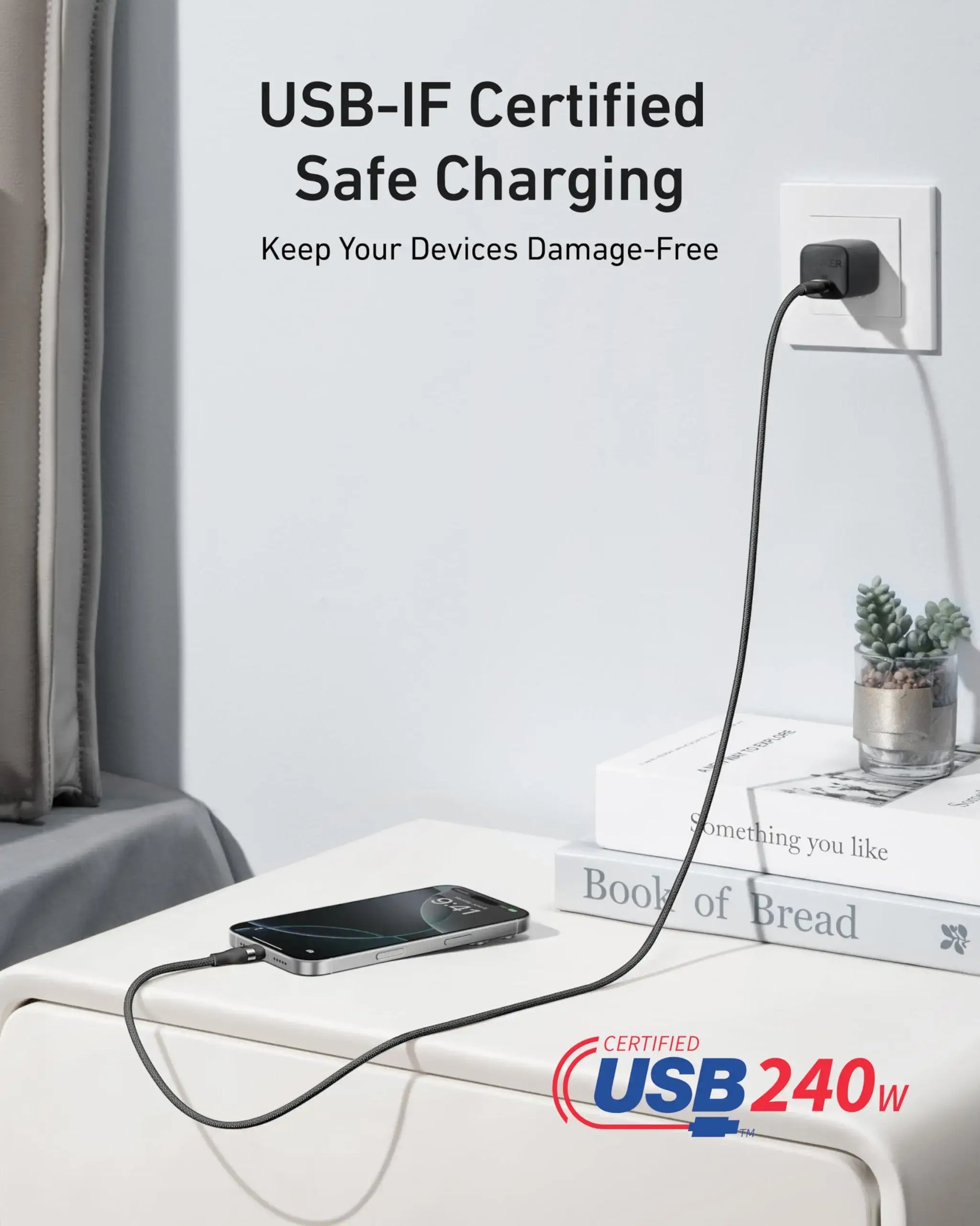 Anker USB-C to USB-C Cable Upcycled-Braided 240W Fast Charging plugged into a wall outlet with a phone charging.