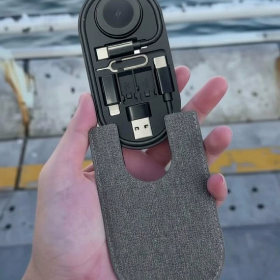 All-in-One Charge Card by Techs Park displayed in hand, showcasing compact, sleek design with charging cables.